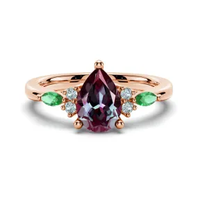 Smooth Feature 1.5 CT. Pear Shaped Alexandrite Engagement Ring With Emerald Accents