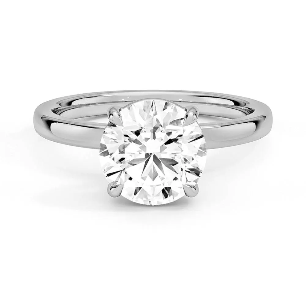 Pure Simplicity Classic Round Solitaire Brilliant Moissanite Engagement Ring