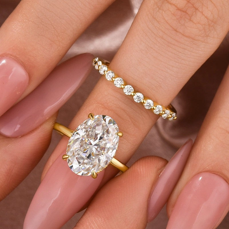 Graceful Highlight Glam Glow Solitaire 5.5Ct Oval Cut Yellow Gold Moissanite Wedding Ring Set With Round Cut Wedding Band