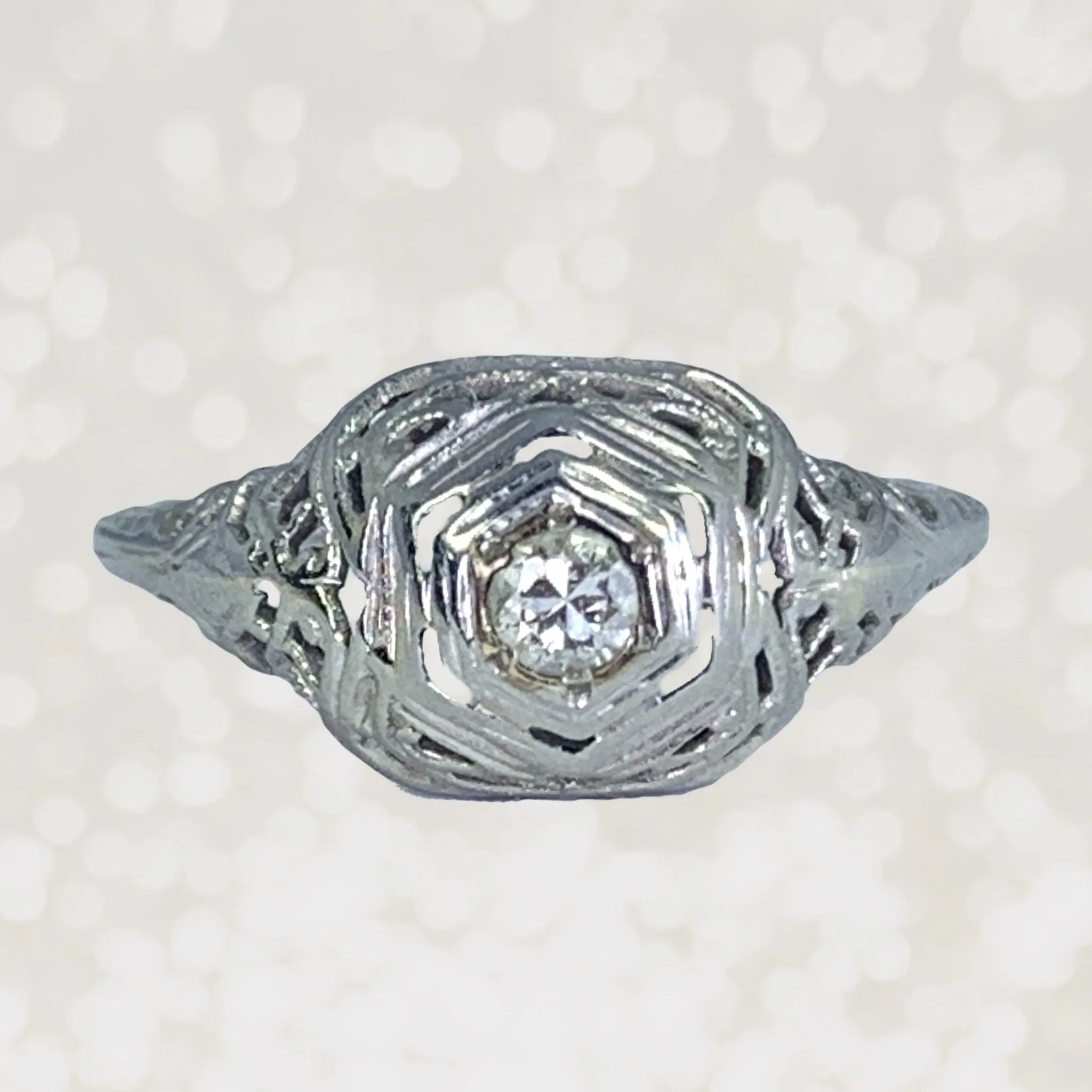 Polished Harmony 1920s Art Deco Diamond Engagement Ring in a 18K White Gold Filigree Setting. Estate Jewelry.